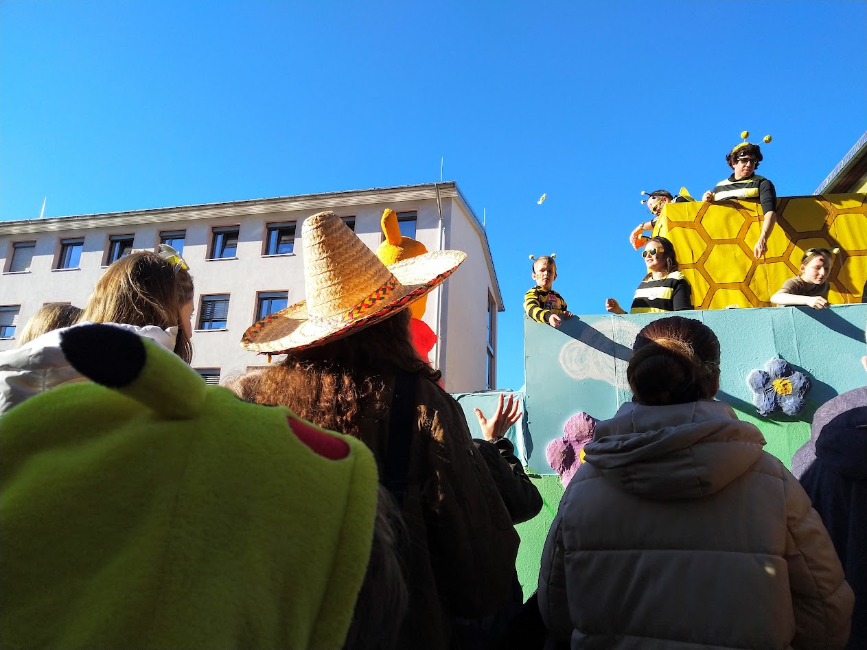 Scene from Carnival, sweets thrown from a carriage.