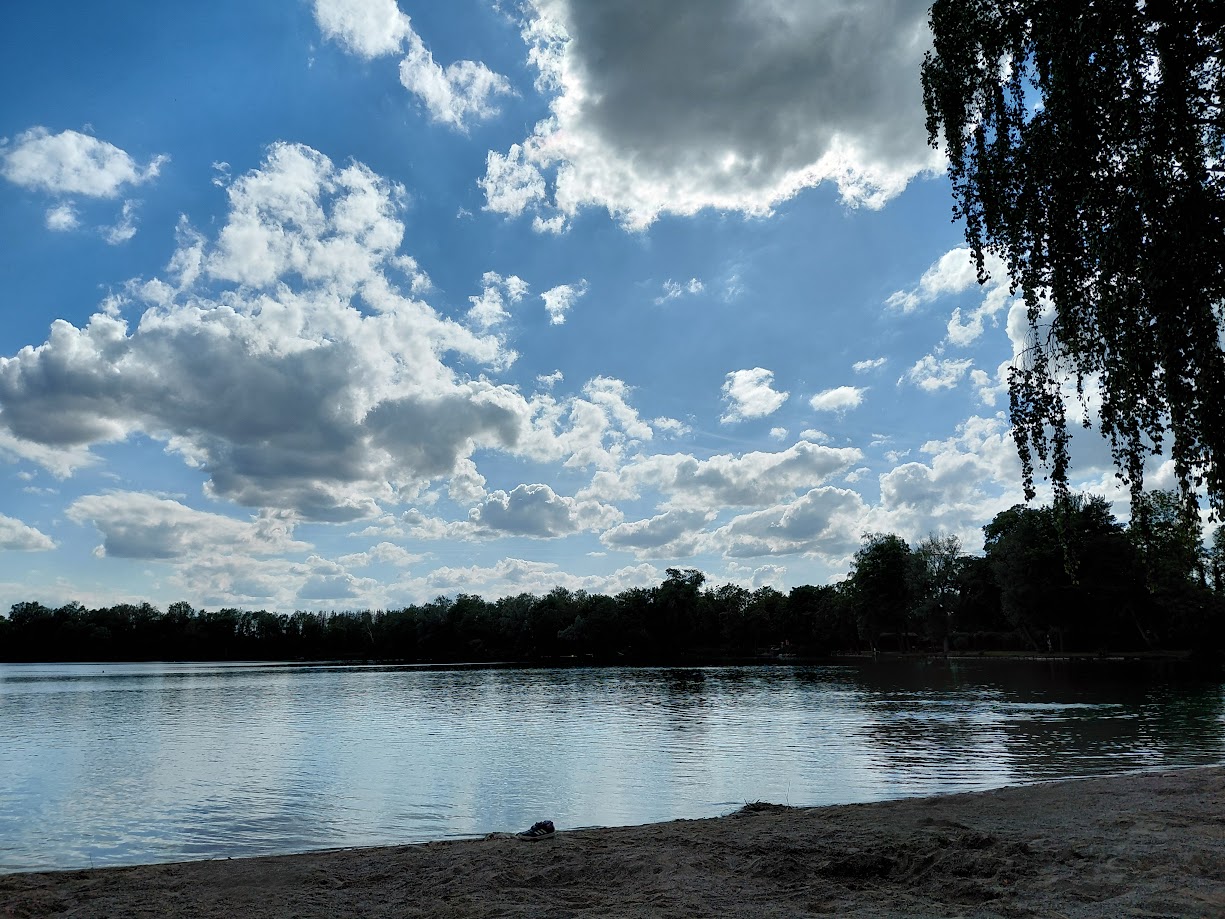 Dramatic clouds over a lake.